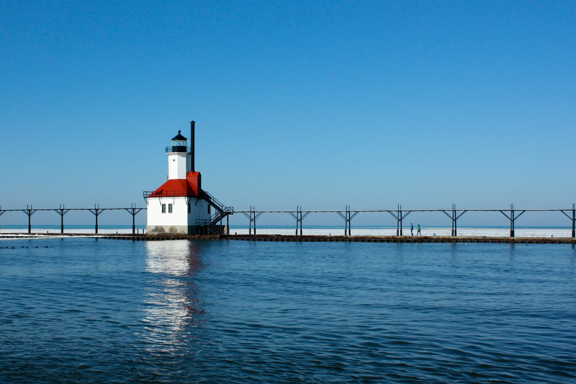 The St. Joseph pier lighthouse under a clear summer sky, Lake Michigan